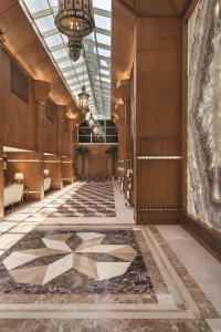 a hallway of a building with a tile floor at Vivid Jeddah Hotel, a member of Radisson Individuals in Jeddah