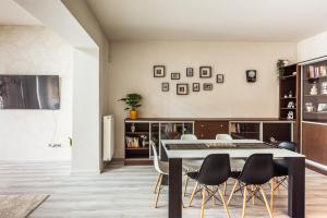 a dining room with a table and chairs at Nice big apartment 2bds - Belgicka in Prague