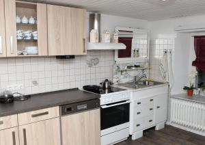 Majoituspaikan Pension Neuenrade keittiö tai keittotila