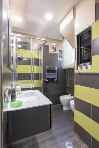 a bathroom with a sink and a toilet at GREEN butterfly house holiday in Rome