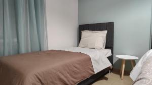 Postel nebo postele na pokoji v ubytování Rock & Roll 1 - Modern apartment in Trikala