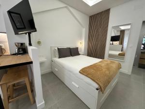 Ένα ή περισσότερα κρεβάτια σε δωμάτιο στο Loft Las Alpujarras - Torremolinos Centro, a 6 minutos de la playa caminando