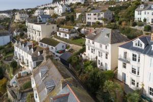 an aerial view of a town with white houses at La Folie, Fowey in Fowey