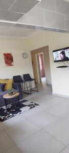 a living room with a couch and a table at Khanyisa Accommodation Services in KwaDukuza