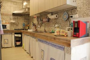 a kitchen with a sink and a counter top at A casa di Sandra, costa dei Trabocchi in Paglieta
