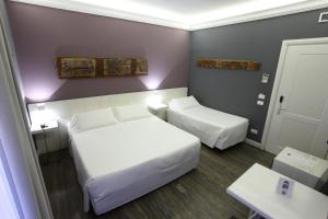 Voodi või voodid majutusasutuse Quintocanto Hotel & Spa toas