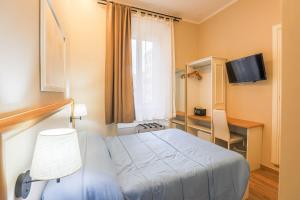 Vuode tai vuoteita majoituspaikassa Binario Zero