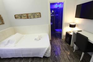 Voodi või voodid majutusasutuse Quintocanto Hotel & Spa toas