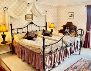a bedroom with a large bed in a room at Villa Billerud in Säffle