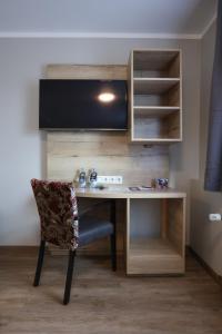 TV a/nebo společenská místnost v ubytování Arthotel ANA Flair