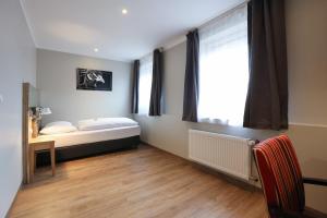 Postel nebo postele na pokoji v ubytování Arthotel ANA Flair