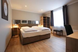Postel nebo postele na pokoji v ubytování Arthotel ANA Flair