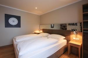 Postel nebo postele na pokoji v ubytování Arthotel ANA Flair
