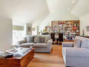 a living room with two couches and a coffee table at 1 Bed in Castle Cary POLOC in West Camel