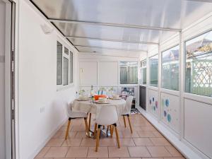 a dining room with a table and chairs at 2 Bed in Ryde 91982 in Brading