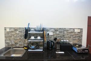 a kitchen counter top with a sink and a counter top at Villa Greenline in Ahangama