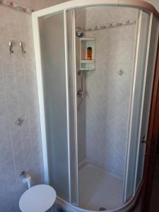 a shower stall in a bathroom with a toilet at Ca' LUCIANO in Castelnuovo Magra