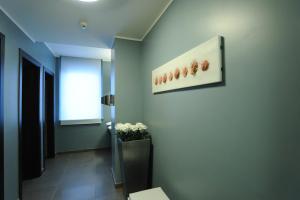 a hallway with a picture of flowers on the wall at Park Hotel Sporting in Teramo