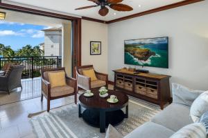 a living room with a couch and a table at Ko Olina Beach Villas O505 in Kapolei