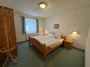 Uma cama ou camas num quarto em Appartement Rettensteiner