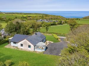 an aerial view of a house in a field at Great Tree House in Llangranog