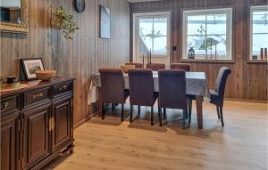 a dining room with a table and chairs at Gorgeous Home In seral With Kitchen in Åseral