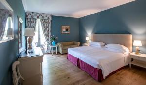 Postel nebo postele na pokoji v ubytování Hotel Franceschi + 37 fotografií