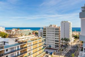 an aerial view of a city with buildings and the ocean at Diana by IVI Real Estate in Benalmádena