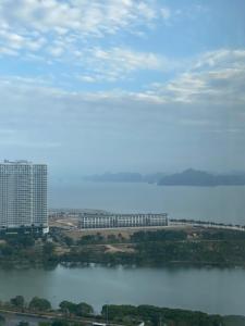 a view of a large building next to a body of water at Homestay HaLong studio in Ha Long