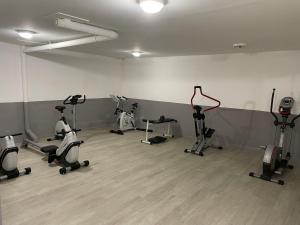 a gym with several exercise bikes in a room at T3cab-Peyragudes-61m2-8pers in Germ