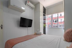 Giường trong phòng chung tại Charme em Copa - Quartos confortáveis - BR401 Z4