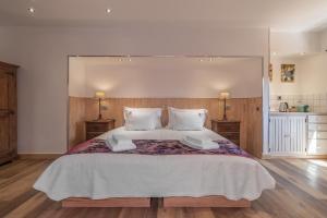 a large bedroom with a large bed with two night stands at Villas D. Dinis - Charming Residence (adults only) in Lagos