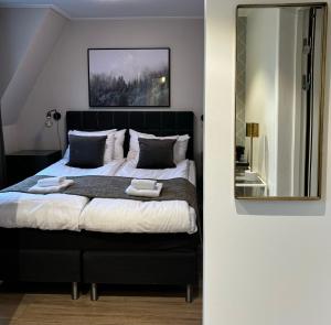 Ένα ή περισσότερα κρεβάτια σε δωμάτιο στο Hotell Esplanad