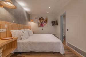a bedroom with a large white bed in a room at Villas D. Dinis - Charming Residence (adults only) in Lagos