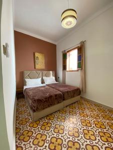 Una cama o camas en una habitación de Riad Jbara 2