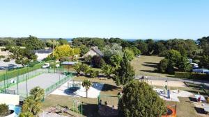 an aerial view of a park with a playground at Camping de la Plage de Cleut-Rouz in Fouesnant