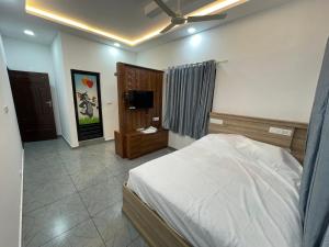 Ένα ή περισσότερα κρεβάτια σε δωμάτιο στο Samudra Homestay +19 φωτογραφίες