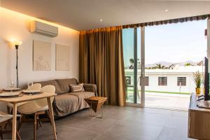 a living room with a couch and a table at Amor a mar octopus in Puerto del Carmen