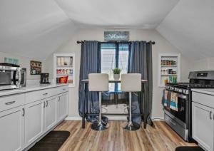 a kitchen with a table and two chairs at St Paul Fry Street Den Tower Suite #3 in Saint Paul