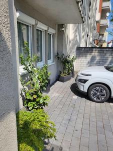 a white car parked in front of a building at holiday home eva in Worms