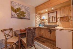 a bathroom with a sink and a table with a sink at Villas D. Dinis - Charming Residence (adults only) in Lagos