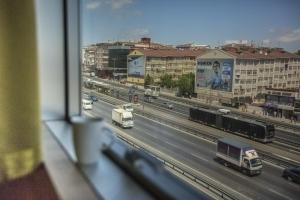 a view from a window of a highway with trucks at Istanbul Fair Hotel in Istanbul