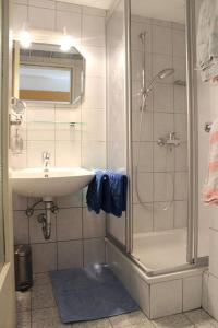 a bathroom with a sink and a shower at Schusterhof in Marquartstein