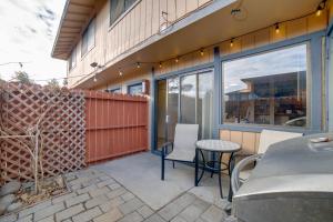 a patio with a table and chairs next to a building at Centrally Located Sparks Condo with Private Patio! in Sparks