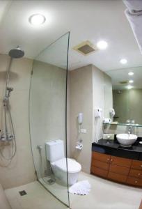 a bathroom with a shower and a toilet and a sink at Allamanda 3 Laguna in Bang Tao Beach