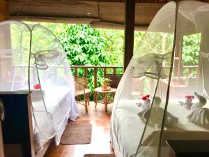 Postel nebo postele na pokoji v ubytování Wanakaset Forest Glamping
