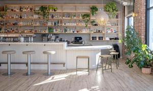 a restaurant with a bar with stools in a room at The Jesse Hotel & Bar in Reno