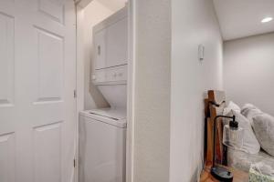 a white laundry room with a washer and dryer at Dells Lakefront Escape - Couples or Families in Wisconsin Dells +20 photos