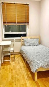 Krevet ili kreveti u jedinici u okviru objekta Homestay in City of London - Fulham