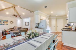 a kitchen and living room with a table and chairs at Houston Home with Screened Porch, Near Sugar Land! in Houston